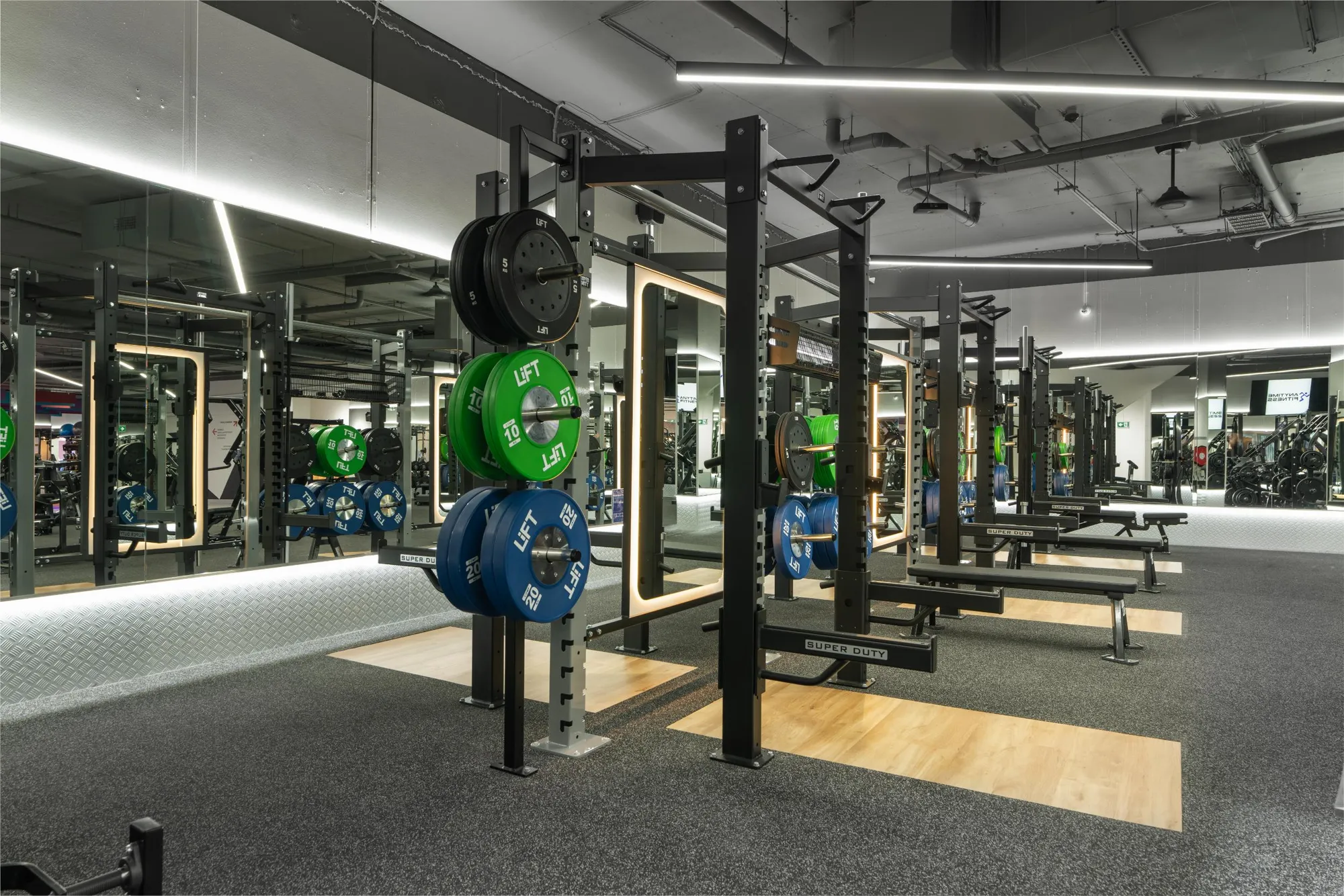 The strength and lifting area at a Maddimax club, with racks and colour-coded plates.